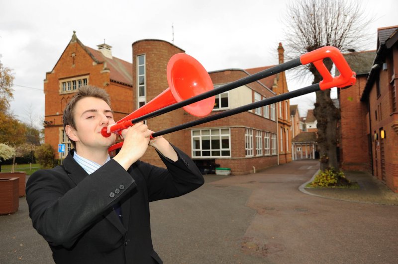 Warwick School's Daniel Kitchin with the red trombone